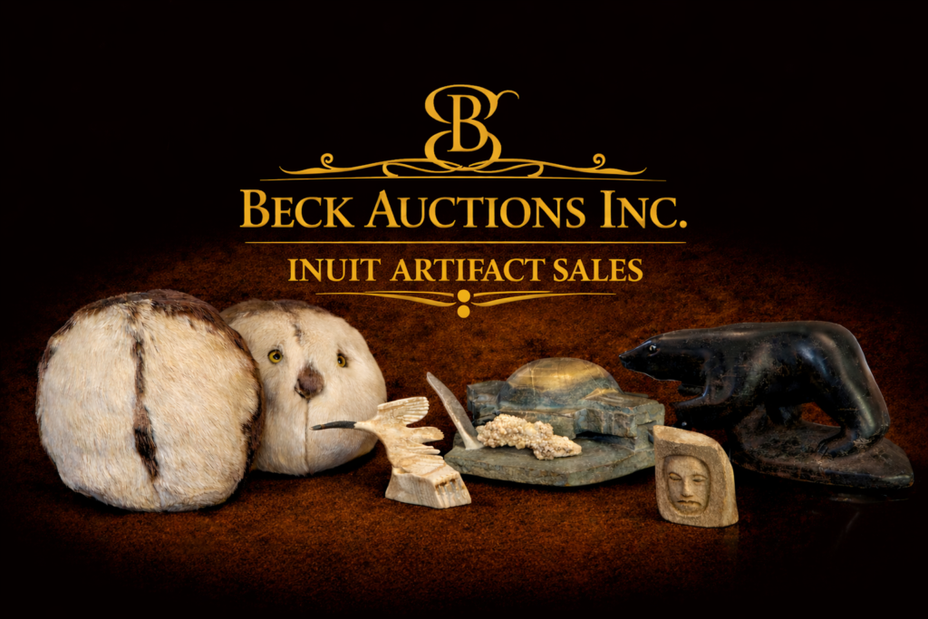 Beck Auctions Inc. banner featuring Inuit artifacts, with a gold logo and title centered above a display of traditional items including fur drum covers, a carved antler bird sculpture, a stone igloo carving, a small carved face, and a black soapstone bear, all set against a dark gradient background fading to black